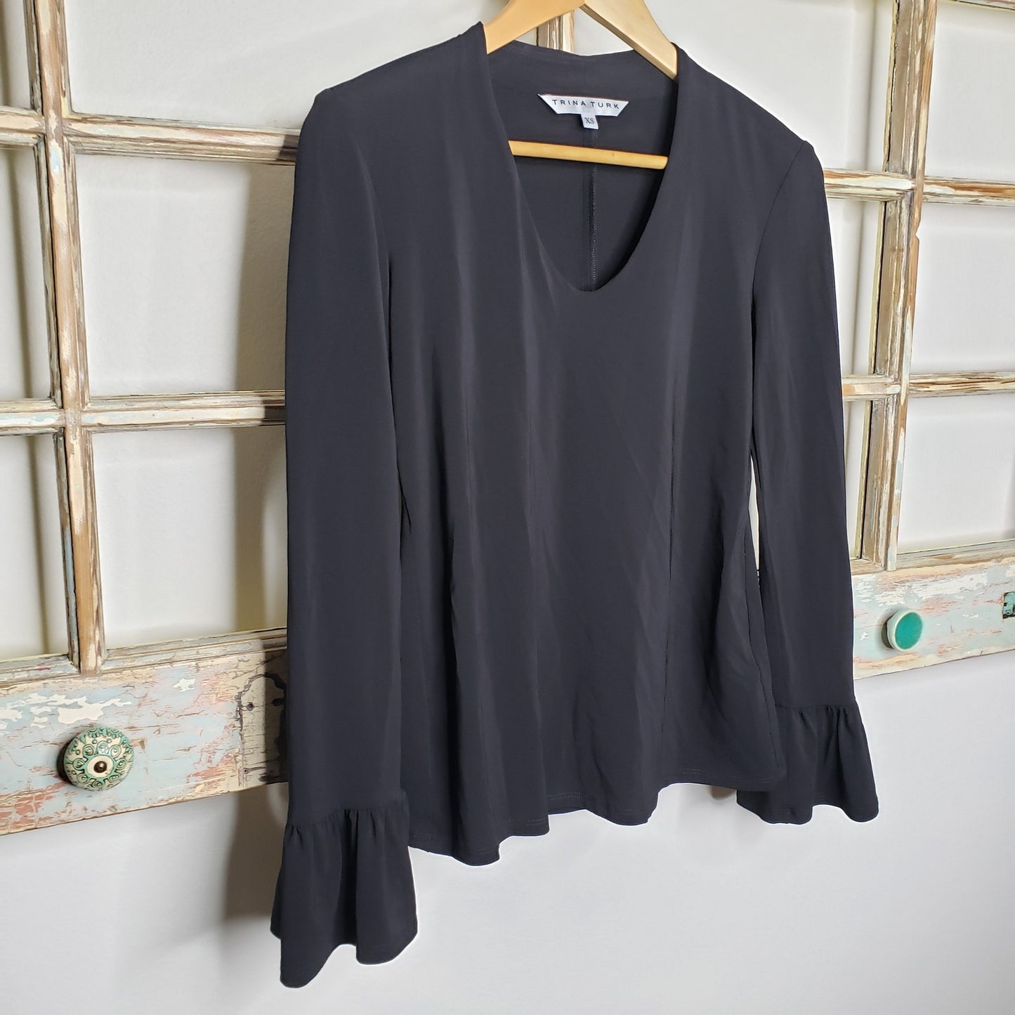 Trina Turk NWT blouse black with ruffled sleeves ladies size XS.