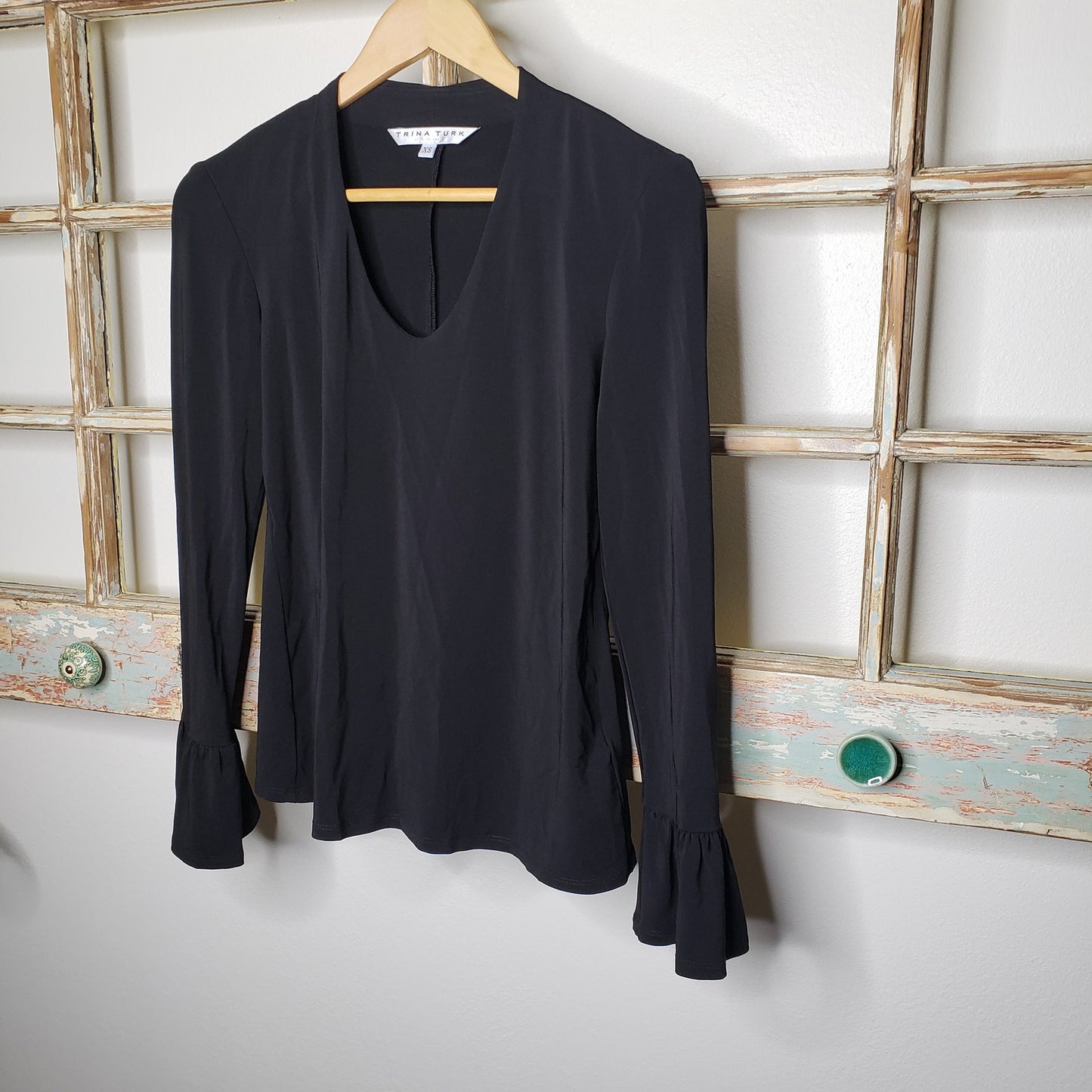 Trina Turk NWT blouse black with ruffled sleeves ladies size XS.